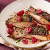 Crispy Skin Salmon topped with fresh raspberries