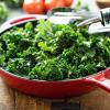 Kale and olive oil in red pan